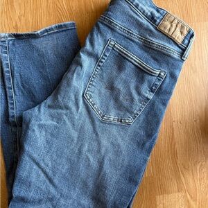 American Eagle Outfitters Men's Airflex + Jeans in Medium Blue.